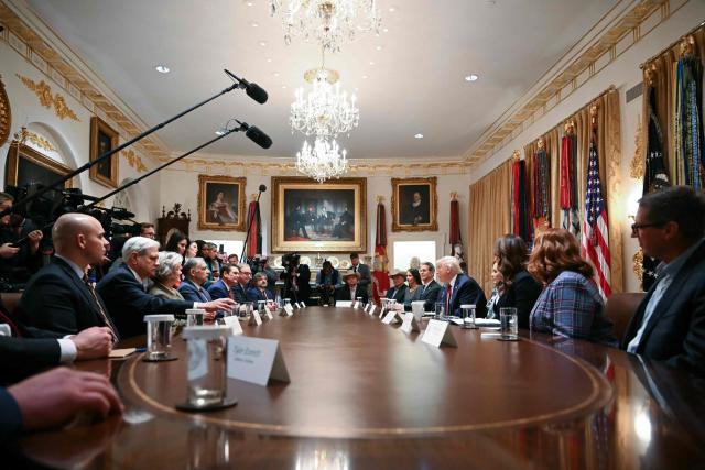 US President Donald Trump participates in a roundtable event to discuss aid for farmers, in the Cabinet Room of the White House in Washington, DC, on December 8, 2025. President Trump is announcing a $12 billion aid package for US farmers, targeting a key support base hit by his trade policies. Since Trump's return to the White House in January, many US farmers have been battered by impacts of his wide-ranging tariffs, including retaliatory measures from trading partners. (Photo by ANDREW CABALLERO-REYNOLDS / AFP)