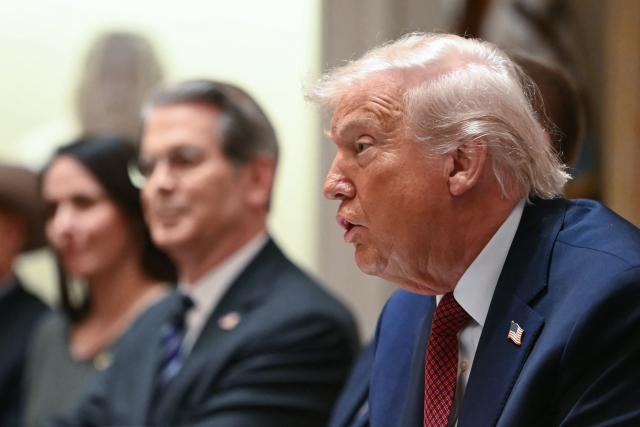 US President Donald Trump speaks during a roundtable event to discuss aid for farmers, in the Cabinet Room of the White House in Washington, DC, on December 8, 2025. President Trump is announcing a $12 billion aid package for US farmers, targeting a key support base hit by his trade policies. Since Trump's return to the White House in January, many US farmers have been battered by impacts of his wide-ranging tariffs, including retaliatory measures from trading partners. (Photo by ANDREW CABALLERO-REYNOLDS / AFP)
