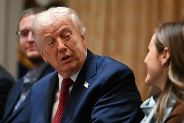 US President Donald Trump speaks during a roundtable event to discuss aid for farmers, in the Cabinet Room of the White House in Washington, DC, on December 8, 2025. President Trump is announcing a $12 billion aid package for US farmers, targeting a key support base hit by his trade policies. Since Trump's return to the White House in January, many US farmers have been battered by impacts of his wide-ranging tariffs, including retaliatory measures from trading partners. (Photo by ANDREW CABALLERO-REYNOLDS / AFP)