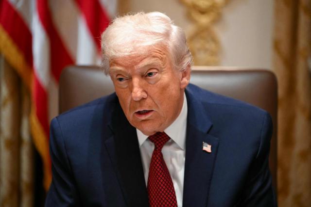 US President Donald Trump speaks during a roundtable event to discuss aid for farmers, in the Cabinet Room of the White House in Washington, DC, on December 8, 2025. President Trump is announcing a $12 billion aid package for US farmers, targeting a key support base hit by his trade policies. Since Trump's return to the White House in January, many US farmers have been battered by impacts of his wide-ranging tariffs, including retaliatory measures from trading partners. (Photo by ANDREW CABALLERO-REYNOLDS / AFP)