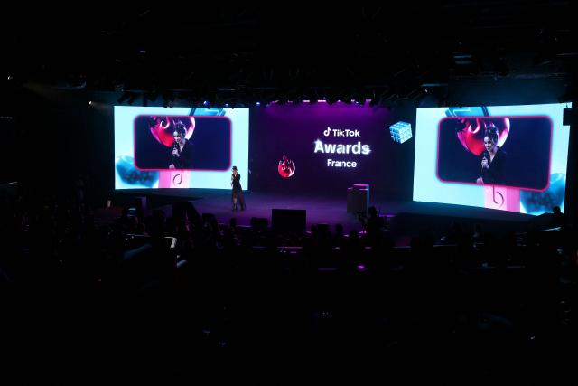 This photograph shows the third edition of the Tiktok Awards ceremony at the Lido cabaret, in Paris on December 8, 2025. (Photo by Thomas SAMSON / AFP)