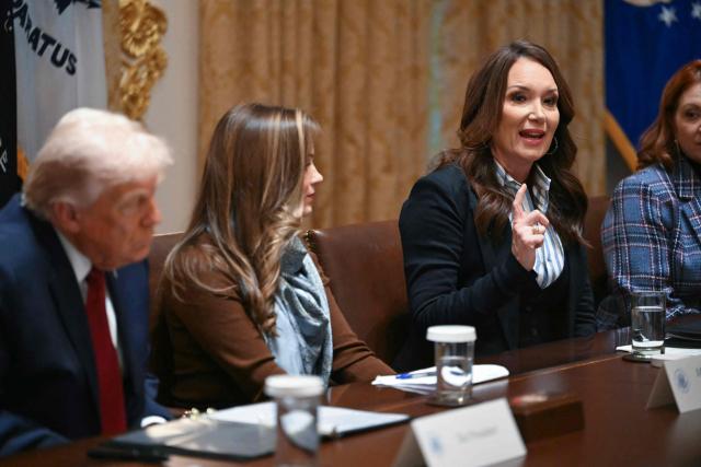 US Secretary of Agriculture Brooke Rollins (R) speaks during a roundtable event hosted by US President Donald Trump to discuss aid for farmers, in the Cabinet Room of the White House in Washington, DC, on December 8, 2025. President Trump is announcing a $12 billion aid package for US farmers, targeting a key support base hit by his trade policies. Since Trump's return to the White House in January, many US farmers have been battered by impacts of his wide-ranging tariffs, including retaliatory measures from trading partners. (Photo by ANDREW CABALLERO-REYNOLDS / AFP)