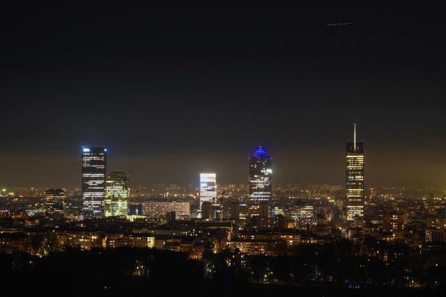 This photograph shows a night view of Lyon's skyline, on December 8, 2025. (Photo by OLIVIER CHASSIGNOLE / AFP)