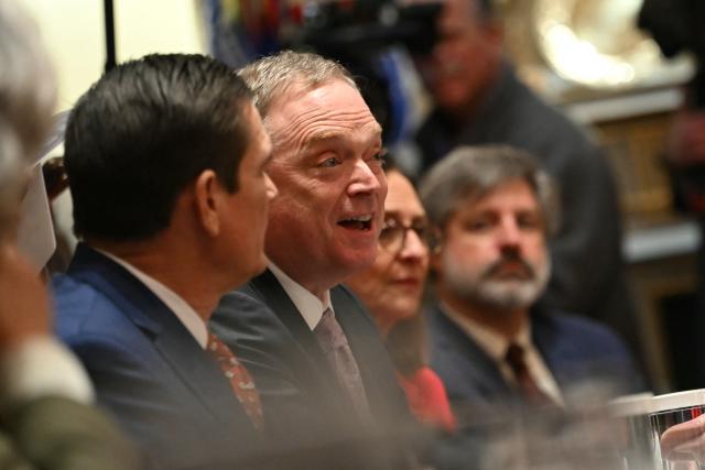 Director of the National Economic Council, Kevin Hassett (C) speaks during a roundtable event hosted by US President Donald Trump to discuss aid for farmers, in the Cabinet Room of the White House in Washington, DC, on December 8, 2025. President Trump is announcing a $12 billion aid package for US farmers, targeting a key support base hit by his trade policies. Since Trump's return to the White House in January, many US farmers have been battered by impacts of his wide-ranging tariffs, including retaliatory measures from trading partners. (Photo by ANDREW CABALLERO-REYNOLDS / AFP)