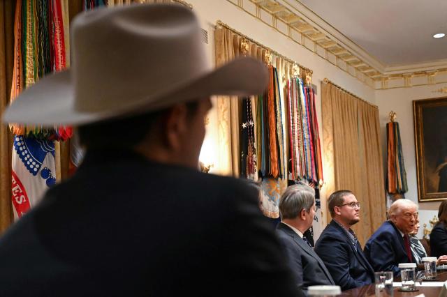 US President Donald Trump speaks during a roundtable event to discuss aid for farmers, in the Cabinet Room of the White House in Washington, DC, on December 8, 2025. President Trump is announcing a $12 billion aid package for US farmers, targeting a key support base hit by his trade policies. Since Trump's return to the White House in January, many US farmers have been battered by impacts of his wide-ranging tariffs, including retaliatory measures from trading partners. (Photo by ANDREW CABALLERO-REYNOLDS / AFP)