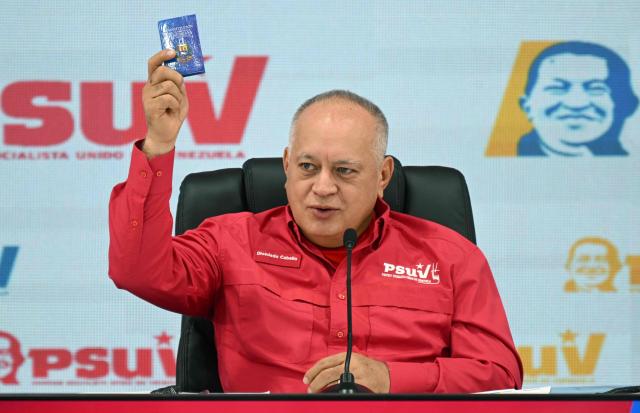 Venezuela's Minister of Interior Relations, Justice, and Peace, Diosdado Cabello, gestures as he speaks during a press conference of the United Socialist Party of Venezuela (PSUV) in Caracas, on December 8, 2025. Cabello stated that he was unaware of details regarding the trip to Oslo by opposition leader Maria Corina Machado, winner of the Nobel Peace Prize, who has been in hiding for over a year, after the Nobel Institute confirmed her attendance at the ceremony next December 10. (Photo by Federico PARRA / AFP)