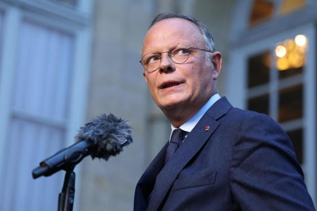 (FILES) President of centre-right Horizons party Edouard Philippe delivers remarks to journalists after a meeting with France's Prime Minister as part of political consultations at the Hotel de Matignon in Paris, on September 2, 2025, a week before the French National Assembly's vote of confidence. Edouard Philippe said on December 8, 2025, on French Television channel, LCI, that he would suggest MPs of the French right wing party Horizons to refrain from voting the draft budget for the Social Security on the eve of a crucial vote in the National Assembly. (Photo by Thomas SAMSON / AFP)