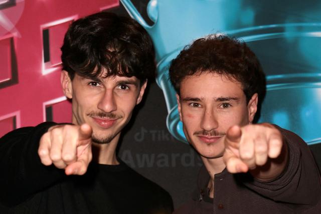 TikTokers known as "marrant club" pose after receiving the Comedy Creator of the Year award during the third edition of the Tiktok Awards ceremony at the Lido cabaret, in Paris on December 8, 2025. (Photo by Thomas SAMSON / AFP)