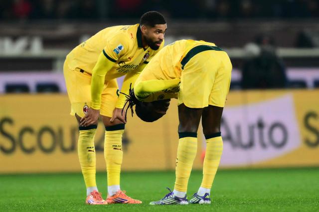 AC Milan's Portuguese forward #10 Rafael Leao (R) reacts after an injury during the Italian Serie A football match between Torino and AC Milan at the Allianz stadium in Turin, on December 8, 2025. (Photo by Marco BERTORELLO / AFP)