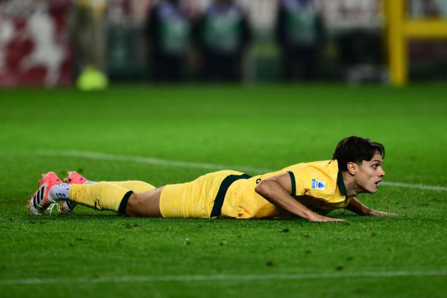 AC Milan's Italian midfielder #04 Samuele Ricci reacts after missing a shot during the Italian Serie A football match between Torino and AC Milan at the Allianz stadium in Turin, on December 8, 2025. (Photo by Marco BERTORELLO / AFP)