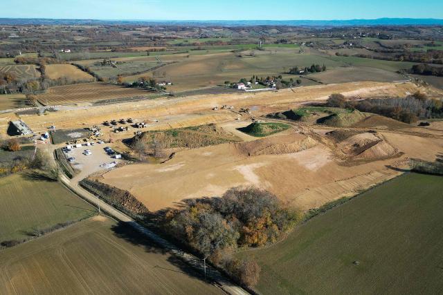 This aerial view, taken on December 8, 2025 in Saix, shows an area of illegal encroachment on the A69 motorway construction site. The prefects of Haute-Garonne and Tarn say they have noted overruns in the construction area of the A69 motorway, as denounced by opponents of the project, and are demanding explanations from the concessionaire, according to a statement released on December 2, 2025. (Photo by Lionel BONAVENTURE / AFP)