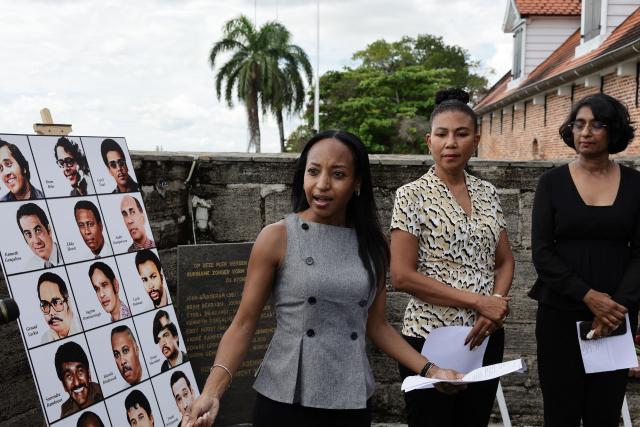 Aishel Bradley delivers a speech during the 43 anniversary of the December murders, when 15 victims were executed, at the former Fort Zeelandia military barracks in Paramaribo on December 8, 2025. Relatives of the 15 victims killed filed a lawsuit against the government demanding rehabilitation and compensation. (Photo by Ranu ABHELAKH / AFP)