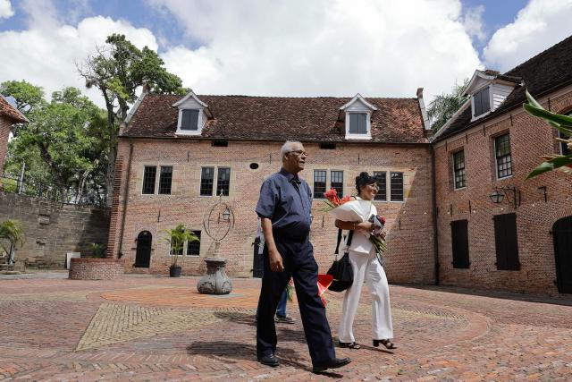 Lawyer Hugo Essed attends arrives for the 43 anniversary of the December murders, when 15 victims were executed, at the former Fort Zeelandia military barracks in Paramaribo on December 8, 2025. Relatives of the 15 victims killed filed a lawsuit against the government demanding rehabilitation and compensation. (Photo by Ranu ABHELAKH / AFP)