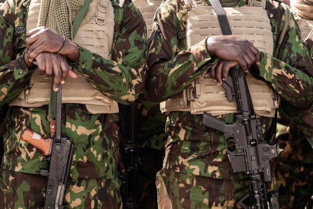 Kenyan police officers arrive at Toussaint Louverture International Airport in Port-au-Prince, Haiti, on December 8, 2025. Kenya announced on December 8th that it had deployed more than 230 highly specialized police officers. They arrive at a critical moment, following the expansion of the Gang Suppression Force's (GSF) mandate published on October 3, 2025. (Photo by Clarens SIFFROY / AFP)