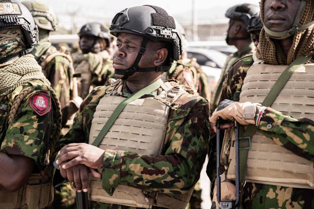 Kenyan police officers arrive at Toussaint Louverture International Airport in Port-au-Prince, Haiti, on December 8, 2025. Kenya announced on December 8th that it had deployed more than 230 highly specialized police officers. They arrive at a critical moment, following the expansion of the Gang Suppression Force's (GSF) mandate published on October 3, 2025. (Photo by Clarens SIFFROY / AFP)