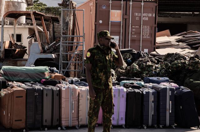 Luggage part of a group of Kenyan police officers are seen as they arrive at Toussaint Louverture International Airport in Port-au-Prince, Haiti, on December 8, 2025. Kenya announced on December 8th that it had deployed more than 230 highly specialized police officers. They arrive at a critical moment, following the expansion of the Gang Suppression Force's (GSF) mandate published on October 3, 2025. (Photo by Clarens SIFFROY / AFP)