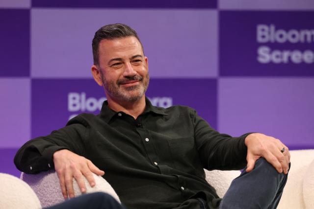 (FILES) Comedian and TV producer Jimmy Kimmel speaks during the Bloomberg Screentime conference in Los Angeles on October 8, 2025. Jimmy Kimmel has extended his contract with Disney-owned ABC for a year, sources said on December 8, 2025, months after his late-night show was yanked off the air in a confrontation with President Donald Trump's administration. (Photo by Patrick T. Fallon / AFP)