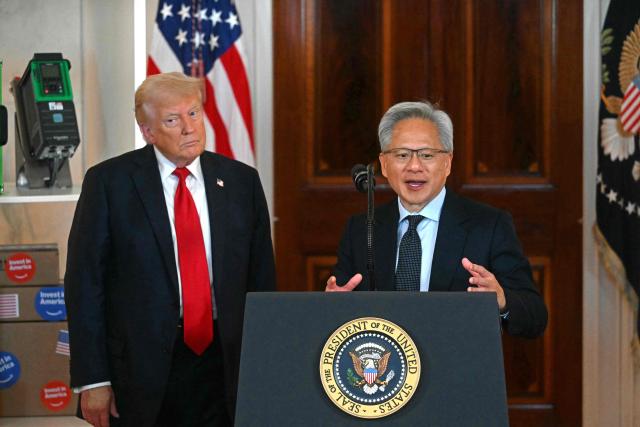(FILES) Nvidia CEO Jensen Huang (R) speaks alongside US President Donald Trump  about investing in America, at the White House in Washington, DC, on April 30, 2025. President Donald Trump said on December 8, 2025 that he had reached an agreement with President Xi Jinping to allow US chip giant Nvidia to export advanced artificial intelligence chips to China. (Photo by Jim WATSON / AFP)