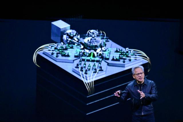 (FILES) NVIDIA CEO Jensen Huang speaks during the Live Keynote Pregame during the Nvidia GTC (GPU Technology Conference) in Washington, DC, on October 28, 2025. President Donald Trump said on December 8, 2025 that he had reached an agreement with President Xi Jinping to allow US chip giant Nvidia to export advanced artificial intelligence chips to China. (Photo by Jim WATSON / AFP)