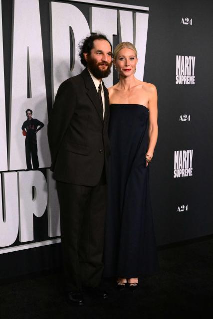 US actress Gwyneth Paltrow (R) and US director Josh Safdie attend the premiere of "Marty Supreme" in Los Angeles, California, on December 8, 2025. (Photo by Frederic J. Brown / AFP)