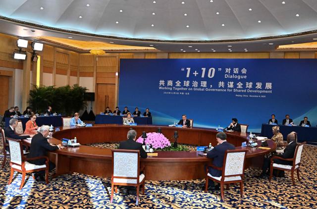 China’s Premier Li Qiang (C) attends The 1+10 Dialogue with leaders of International Economic Organisations in Beijing on December 9, 2025. (Photo by Pedro PARDO and Pedro Pardo / POOL / AFP)