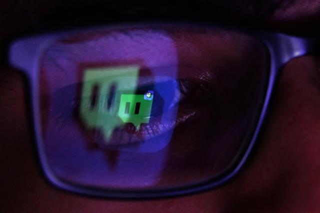 A 13-year-old boy poses at his home as he looks at social media on his tablet in Sydney on December 8, 2025. Australia will ban young teenagers from social media on December 10, 2025, launching a world-first crackdown designed to unglue children from addictive scrolling on the likes of Facebook, Instagram and TikTok. (Photo by Saeed KHAN / AFP)