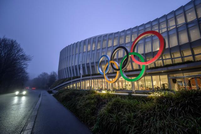 This photograph shows the Olympics Rings at the entrance of the Olympic House in Lausanne, on December 9, 2025. (Photo by Fabrice COFFRINI / AFP)