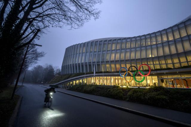 This photograph shows the Olympics Rings at the entrance of the Olympic House in Lausanne, on December 9, 2025. (Photo by Fabrice COFFRINI / AFP)