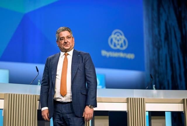 Thyssenkrupp CEO Miguel Angel Lopez Borrego arrives to address the annual news conference of German industrial titan Thyssenkrupp at the company's headquarters in Essen, western Germany on December 9, 2025. The company announced it expected a loss next year as it grapples with a tough market environment and seeks to offload employees. The firm said it would lose between 400 and 800 million euros ($466 and $932 million) in 2026 because of weak demand and "in particular" the costs of restructuring its steel business. (Photo by Ina FASSBENDER / AFP)