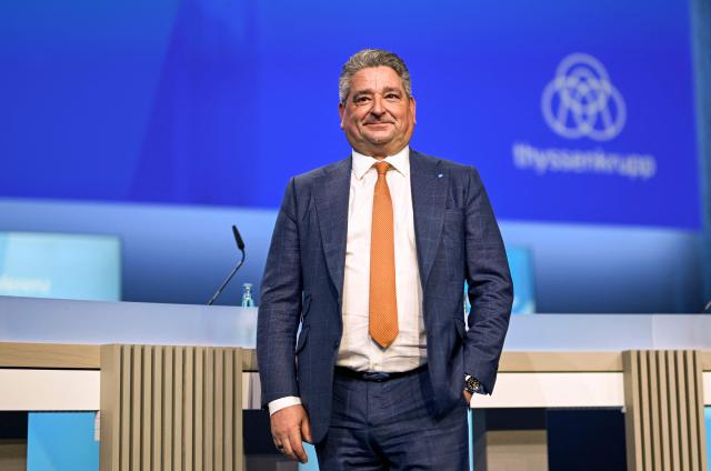 Thyssenkrupp CEO Miguel Angel Lopez Borrego arrives to address the annual news conference of German industrial titan Thyssenkrupp at the company's headquarters in Essen, western Germany on December 9, 2025. The company announced it expected a loss next year as it grapples with a tough market environment and seeks to offload employees. The firm said it would lose between 400 and 800 million euros ($466 and $932 million) in 2026 because of weak demand and "in particular" the costs of restructuring its steel business. (Photo by Ina FASSBENDER / AFP)
