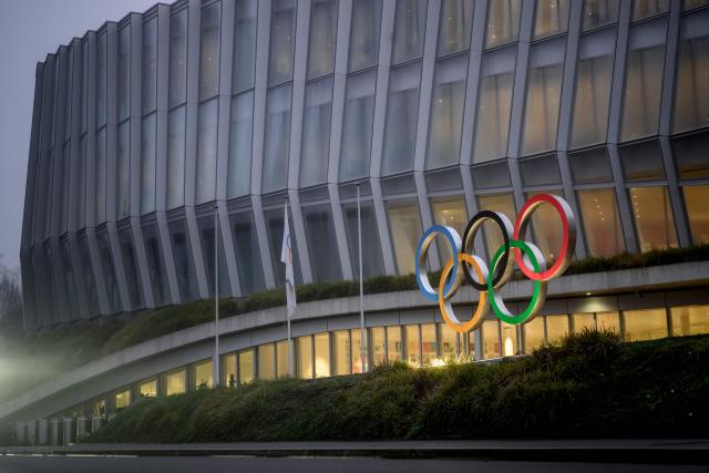 This photograph shows the Olympics Rings at the entrance of the Olympic House in Lausanne, on December 9, 2025. (Photo by Fabrice COFFRINI / AFP)