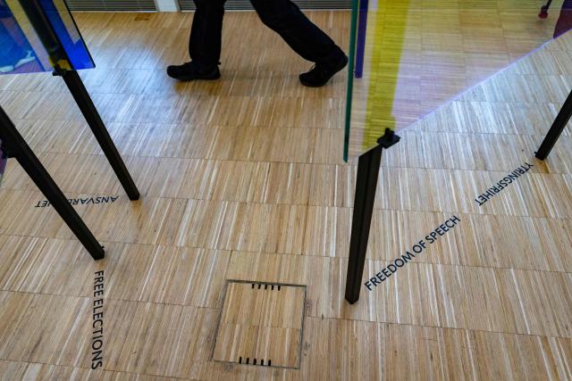 Visitors attend the exhibition "Democracy on the brink" in honour of Nobel Peace Prize laureate Maria Corina Machado at the Nobel Peace Center in Oslo on December 9, 2025, on the eve of the Nobel Peace Prize ceremony. The new exhibition featuring the 2025 laureate opens to the public on December 12, 2024. (Photo by Odd ANDERSEN / AFP)