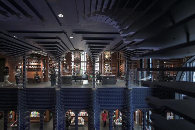 People visit a bookstore in Tianjin on December 9, 2025. (Photo by ADEK BERRY / AFP)