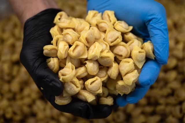 (FILES) Italian home made pasta Agnolotti are pictured at a stand of the Slow Food Salone del Gusto and Terra Madre on September 26, 2024 in Turin. Italy is waiting for the final decision of Unesco, on December 10, 2025, regarding the recognition of Italian cuisine as an "Intangible Cultural Heritage of Humanity". (Photo by MARCO BERTORELLO / AFP)