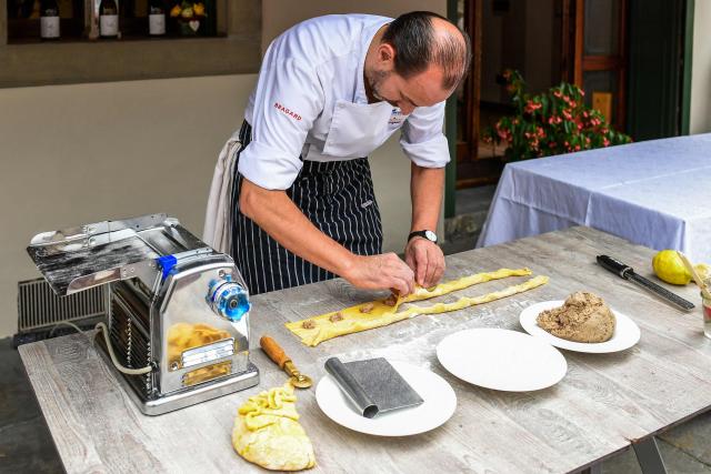 (FILES) Chef Samuel Perico, of the 'Trattoria Sant'Ambroeus' in Bergamo's upper city, prepares typical pasta dish "I Casoncelli" on June 16, 2020. Italy is waiting for the final decision of Unesco, on December 10, 2025, regarding the recognition of Italian cuisine as an "Intangible Cultural Heritage of Humanity". (Photo by Miguel MEDINA / AFP)