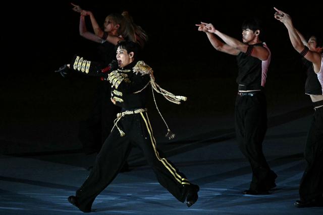 Thai rapper and singer BamBam performs during the opening ceremony of the 33rd Southeast Asian Games (SEA Games) at Rajamangala National Stadium in Bangkok on December 9, 2025. (Photo by Lillian SUWANRUMPHA / AFP)