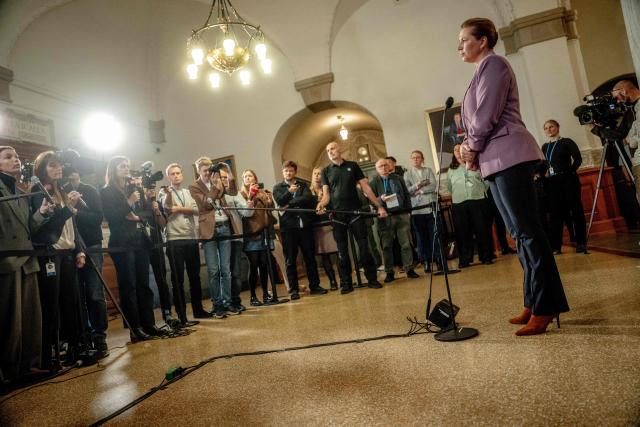 Denmark's Prime Minister Mette Frederiksen holds a doorstep after the question time at the Parliament at Christiansborg in Copenhagen, on December 9, 2025. (Photo by Mads Claus Rasmussen / Ritzau Scanpix / AFP) / Denmark OUT