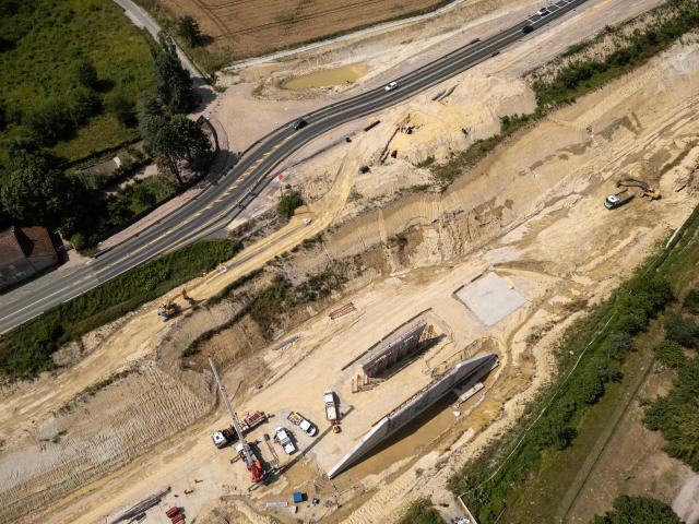 (FILES) This aerial view shows a construction site of the embattled A69 autoroute project near Verfeil, south-western France, on June 24, 2025. The public rapporteur recommends continuing construction of the A69 motorway and advises the administrative court of appeal to overturn the Toulouse administrative tribunal's February ruling that halted the works, according to lawyers for the parties, on December 9, 2025. (Photo by Lionel BONAVENTURE / AFP)