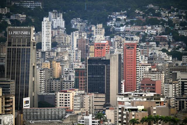 Werial view of residential buildings in the eastern area of Caracas, on December 9, 2025. (Photo by Federico PARRA / AFP)