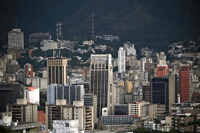 Werial view of the eastern area of Caracas, on December 9, 2025. (Photo by Federico PARRA / AFP)