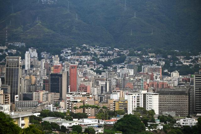 Werial view of the eastern area of Caracas, on December 9, 2025. (Photo by Federico PARRA / AFP)