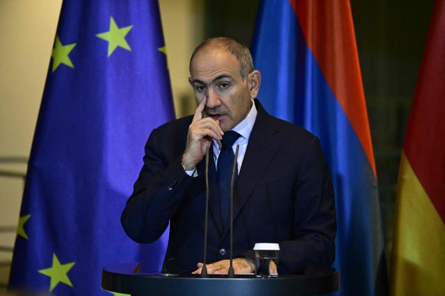 Armenia's Prime Minister Nikol Pashinyan gestures as he addresses a joint press conference with the German Chancellor at the Chancellery in Berlin, Germany, on December 9, 2025. (Photo by John MACDOUGALL / AFP)