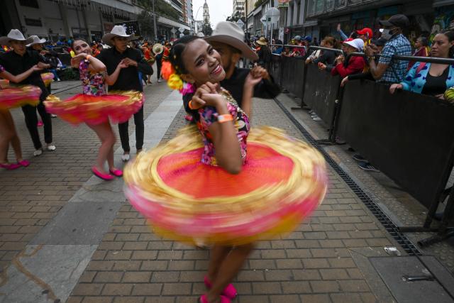 (FILES) Dancers perform the traditional Colombian and Venezuelan dance "Joropo" during a presentation to celebrate its inscription as an Intangible Cultural Heritage of Humanity by the UNESCO in Bogota, on November 6, 2022. Venezuela's "joropo" -- a genre blending music, song and fast-paced partner dancing -- was named on December 9, 2025 as a UNESCO intangible cultural treasure. (Photo by Juan BARRETO / AFP)