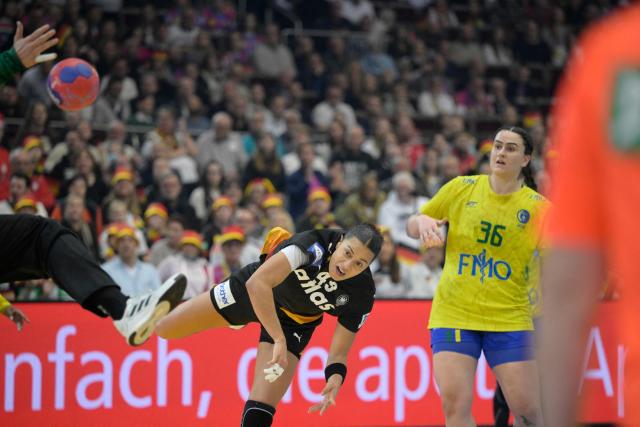 Germany's left back #49 Aimee von Pereira shoots the ball during the quarter final match between Germany and Brazil of the IHF Women's Handball World Championship in Dortmund, western Germany on December 9, 2025. (Photo by Sascha Schuermann / AFP)