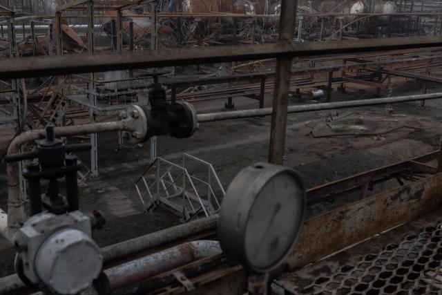 (FILES) This photograph taken on December 2, 2025, shows damaged parts of the Naftogaz gas facility, following Russian missile and drone attacks, in Ukraine, amid the Russian invasion of Ukraine. Ukraine faces possibly its toughest winter since Russia invaded, the head of the country's state-run gas operator told AFP in December 2025, accusing Moscow of being determined to cut off heating to civilians as temperatures plunge below zero. (Photo by Roman PILIPEY / AFP)