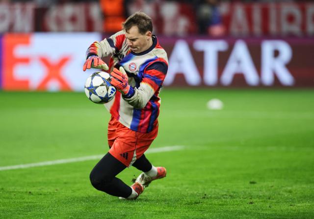 Bayern Munich's German goalkeeper #01 Manuel Neuer warms up prior to the UEFA Champions League, league phase - day 6 football match between Bayern Munich and Sporting CP in Munich, western Germany, on December 9, 2025. (Photo by Alexandra BEIER / AFP)