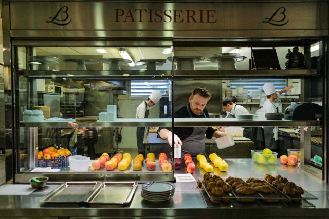 (FILES) A cook works in the kitchen of the restaurant "La Cфte d’Or - Le Relais Bernard Loiseau" in Saulieu, central France, on February 9, 2023. Dijon, Beaune, Besanзon, Metz, and even Tokyo: despite the suicide of its eponymous owner, three-star chef Bernard Loiseau, in 2003, the establishment he founded 50 years ago has become a small empire. (Photo by Olivier CHASSIGNOLE / AFP)