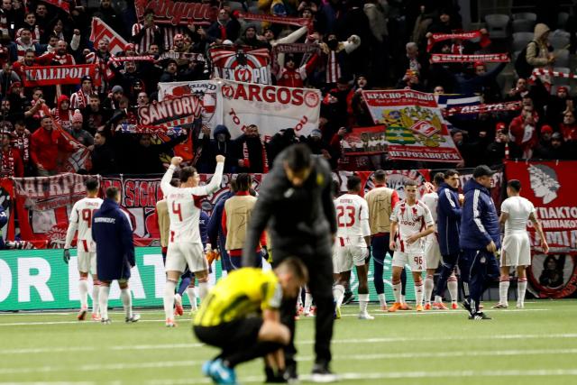 Olympiacos' players celebrate after the UEFA Champions League league phase football match between Kairat Almaty and Olympiacos at the Astana Arena in Astana on December 9, 2025. (Photo by STANISLAV FILIPPOV / AFP)
