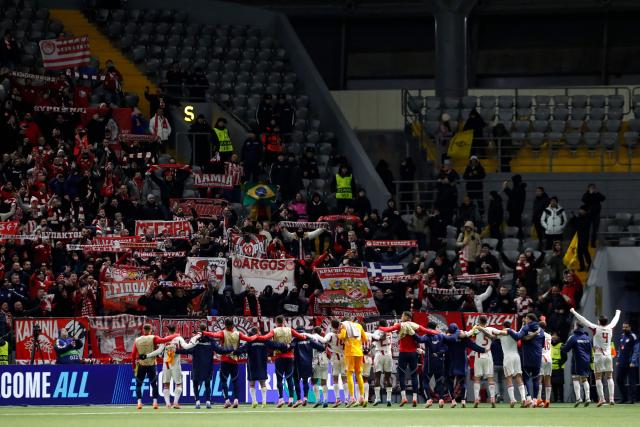 Olympiacos' players celebrate after the UEFA Champions League league phase football match between Kairat Almaty and Olympiacos at the Astana Arena in Astana on December 9, 2025. (Photo by STANISLAV FILIPPOV / AFP)