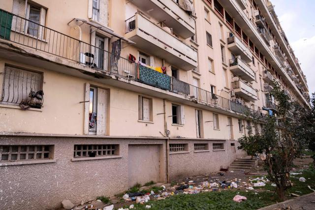This photograph shows buildings of the "La Cite des Rosiers" residential complex, in the Sainte Marthe neighborhood, northern Marseille, on December 9, 2025. (Photo by Miguel MEDINA / AFP)